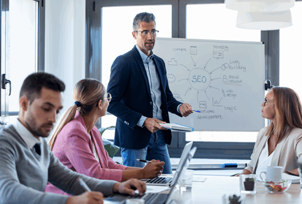 Businessman explaining SEo to a group
