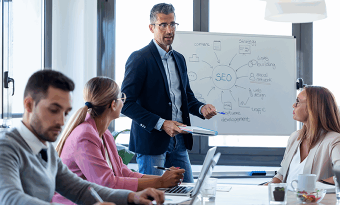 Businessman explaining SEo to a group