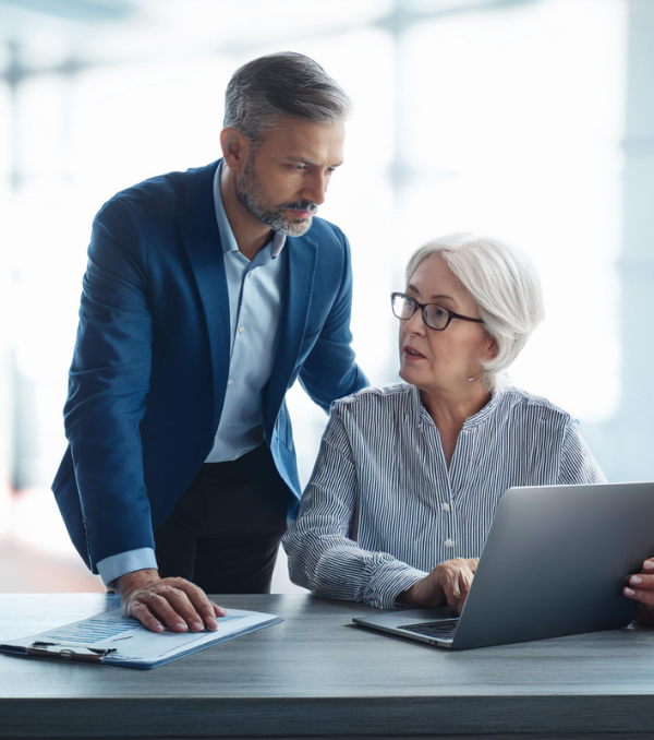 Man and woman talking at computer