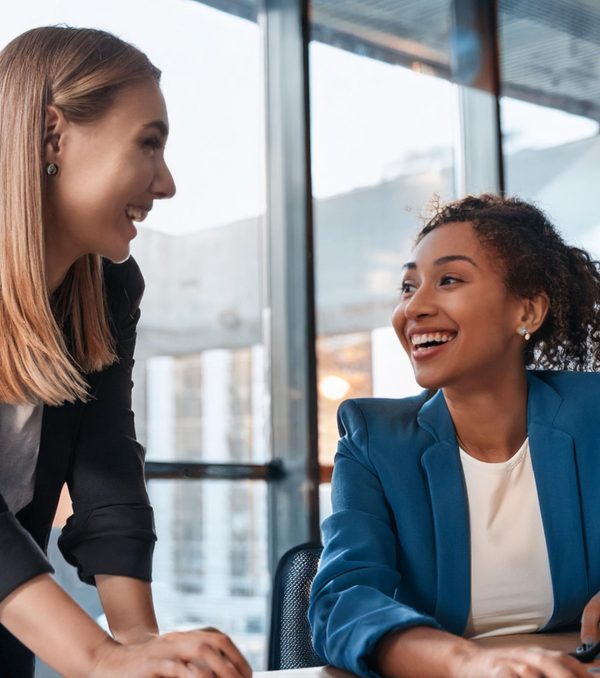 Two women working at a desk